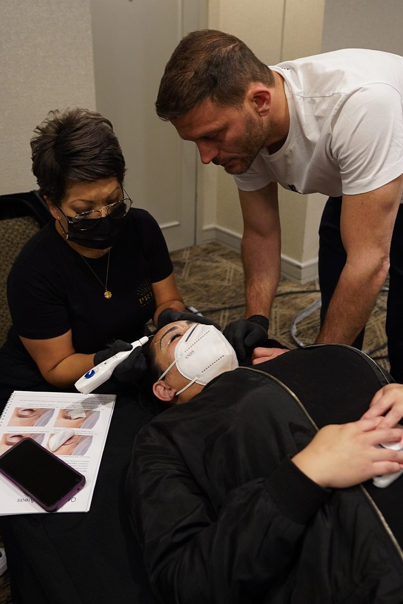 A Privé trainer working alongside a student on a model
